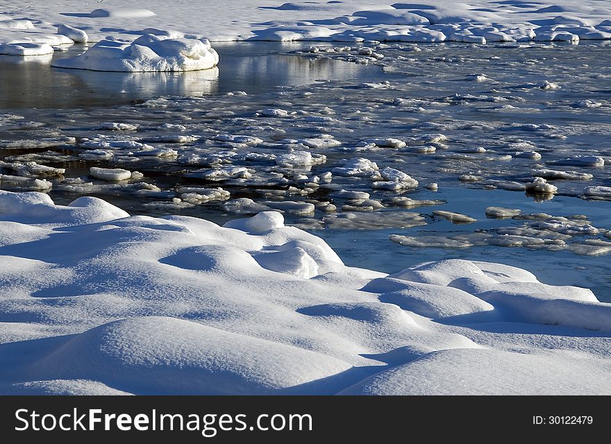 Ocean with ice flakes in outdoor scene. Ocean with ice flakes in outdoor scene