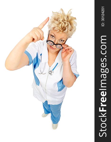 Angry adult woman in medical suit shows finger up in camera and holds glasses on white background. Angry adult woman in medical suit shows finger up in camera and holds glasses on white background