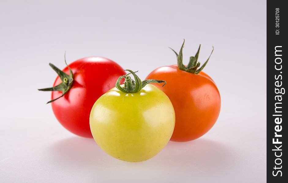 Fresh tomatoes on white background