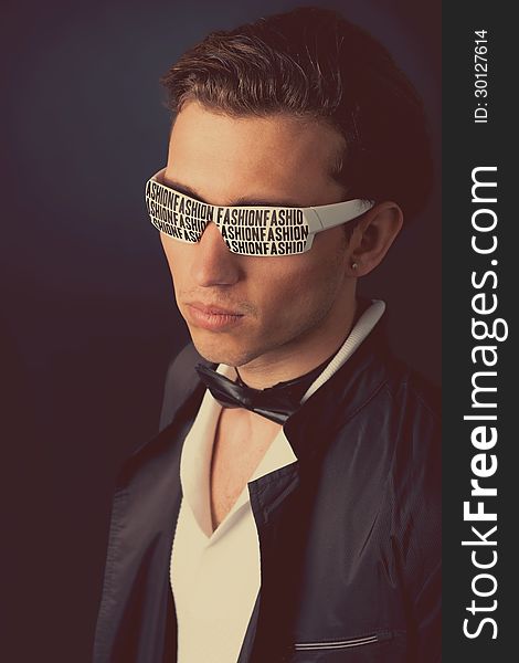 Stylish man in exclusive white sunglasses in trendy colors. Stylish man in exclusive white sunglasses in trendy colors