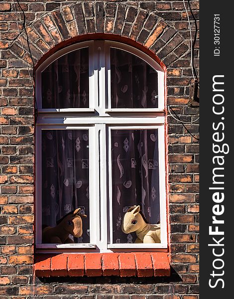 Window of the residential building in Nikiszowiec, one of the districts of Katowice, Silesia region Poland. The place is historic coal miners' settlement built between 1908–1918. Window of the residential building in Nikiszowiec, one of the districts of Katowice, Silesia region Poland. The place is historic coal miners' settlement built between 1908–1918.