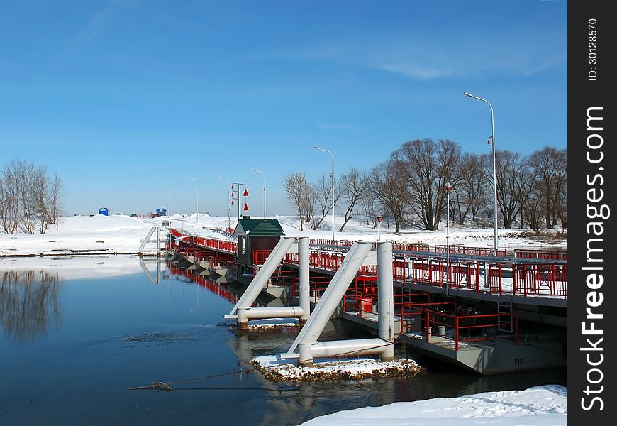 Bridge over the river in the countryside in the early spring. Bridge over the river in the countryside in the early spring