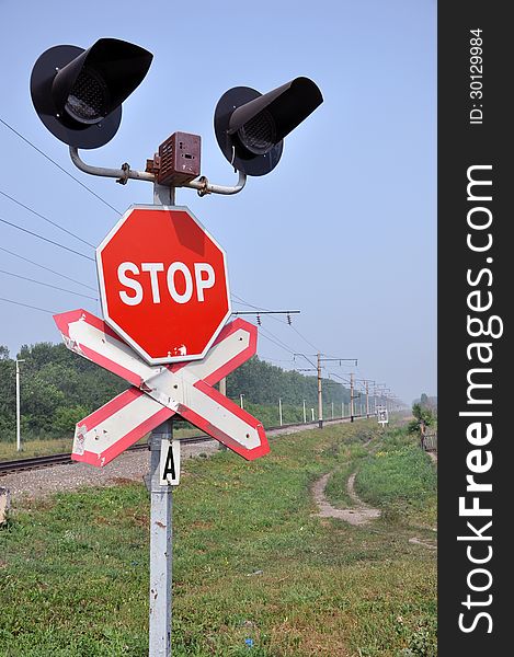 The sign of a stop at a railway crossing. The sign of a stop at a railway crossing.