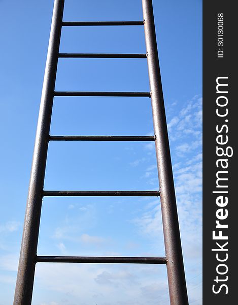 Iron staircase leading to the blue sky. Iron staircase leading to the blue sky.