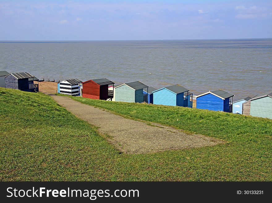 Photo showing path down to beach huts and sea at Whitstable in kent. Photo showing path down to beach huts and sea at Whitstable in kent.