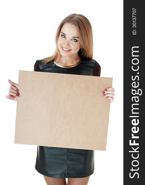 Beautiful smiling girl showing   empty wooden notice board.