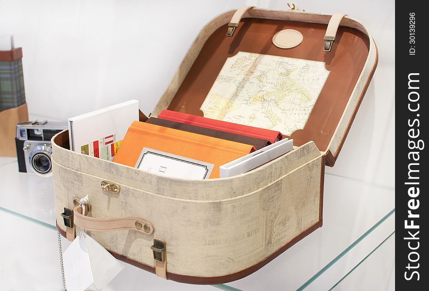 Old fashioned hand made suitcase full of books. Old fashioned hand made suitcase full of books