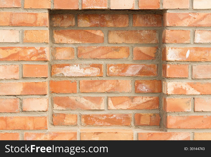 Full frame background of brick red wall with recess. Full frame background of brick red wall with recess