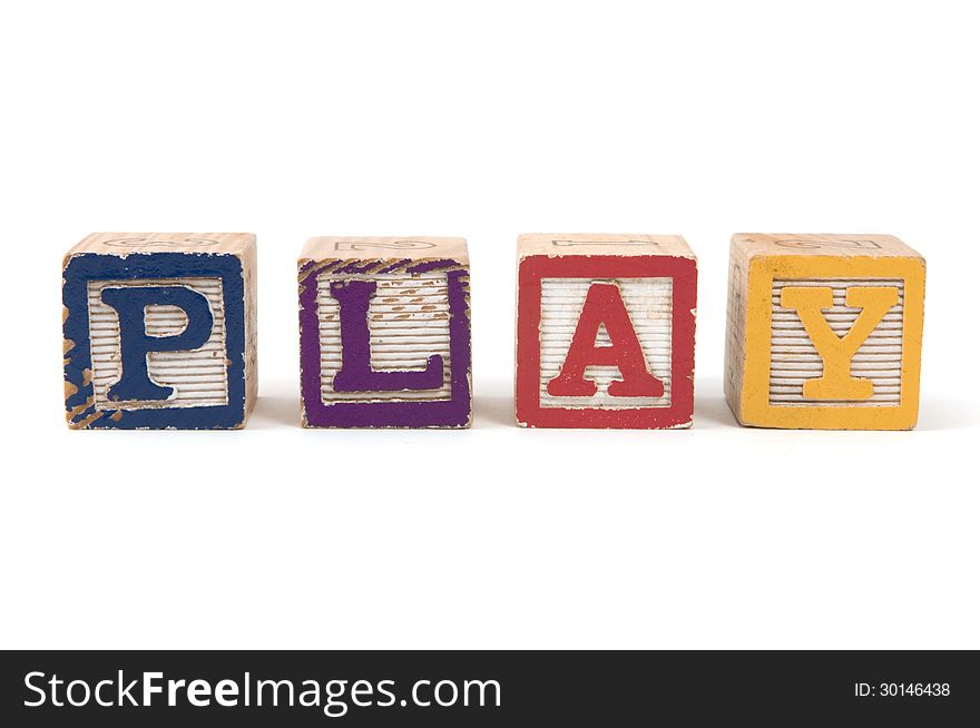 Children's wooden blocks spelling the word PLAY