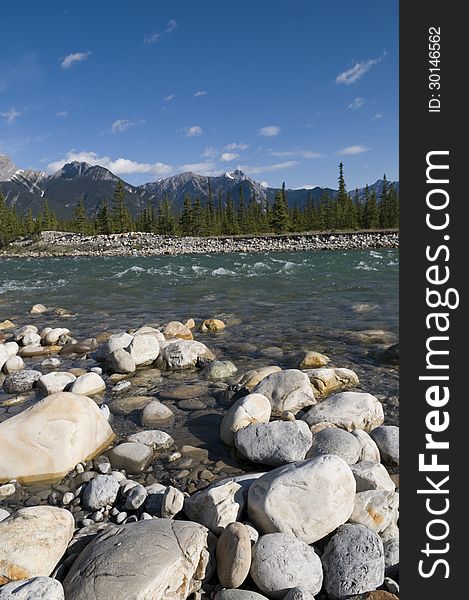 Boulders in the foreground of the Snaring River in Jasper National Park. Boulders in the foreground of the Snaring River in Jasper National Park