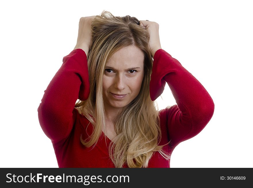 Portrait of a young stressed woman pulling hair isolated on white background. Portrait of a young stressed woman pulling hair isolated on white background