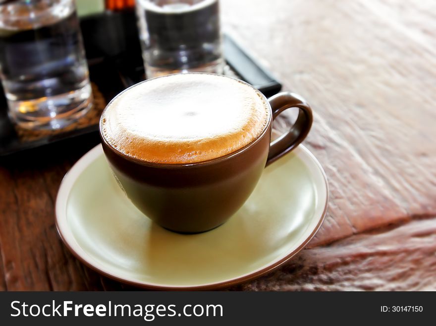 Cappuccino on wooden table,food and drink background. Cappuccino on wooden table,food and drink background