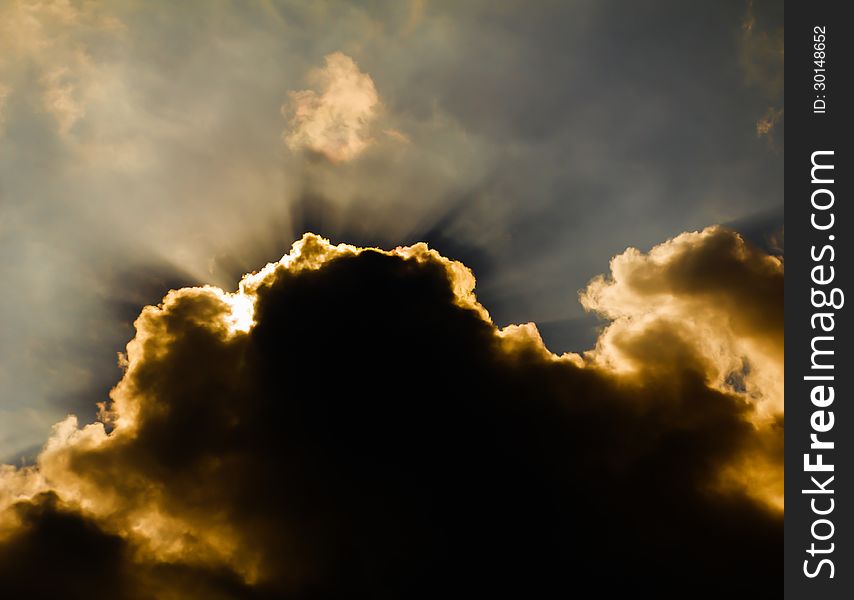 Image of sun shine through rain cloud