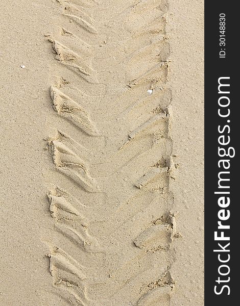 Tread pattern of truck tire in soft sand. Tread pattern of truck tire in soft sand