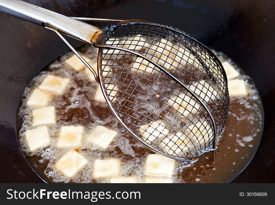 Fried bean curd in the hot oil