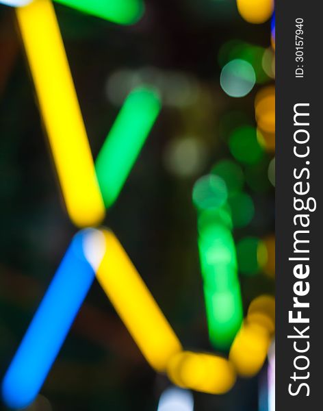 Ferris Wheel At Night With Colorful Bokeh