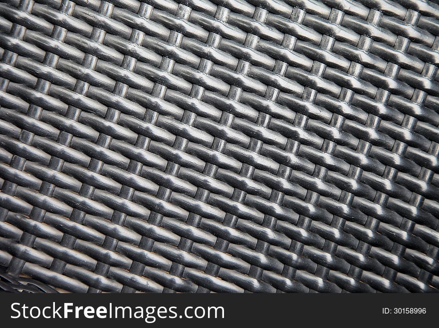 Weaved black bamboo rattan texture background