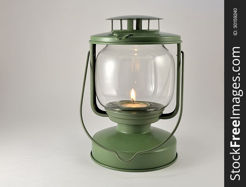 Portable lamp with a candle