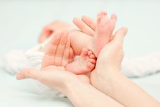 Little Baby Feet And Hands Of The Mother Stock Photos