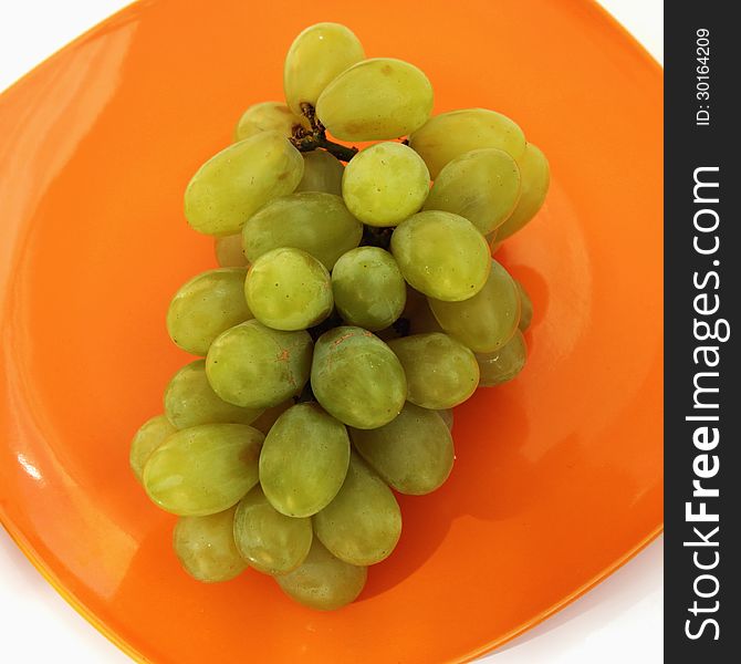 Bunch of grapes on a light background (details)