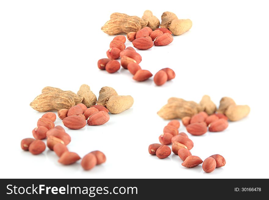 A lot of Peanuts (Three action Peanuts) on isolated over white background. A lot of Peanuts (Three action Peanuts) on isolated over white background.