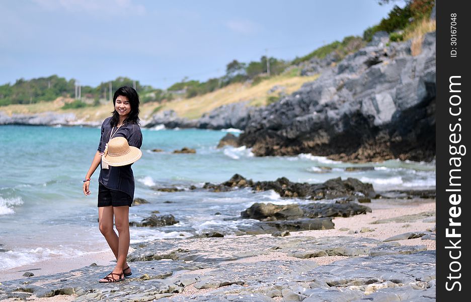 Beautiful young woman on beach summer holiday. Portrait of asian