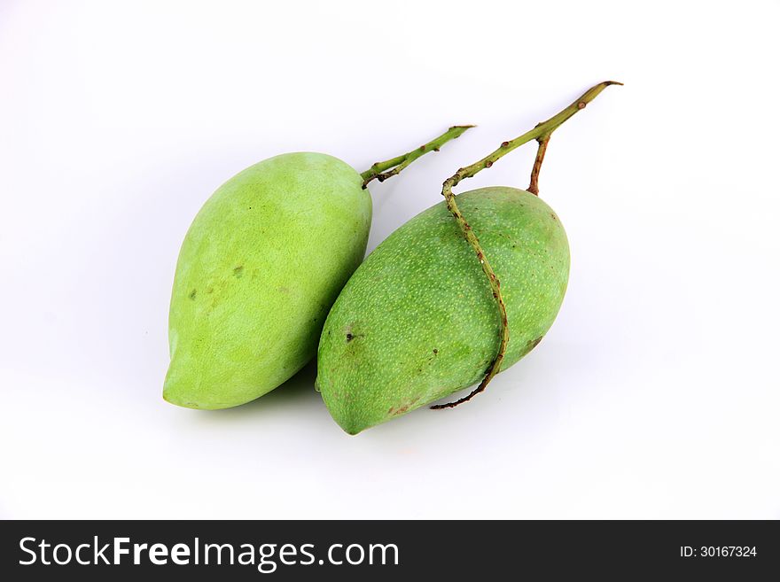 The Ripe mangoes are in the green color,on white Background. The Ripe mangoes are in the green color,on white Background.