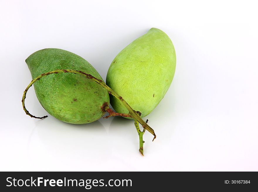 A Green Mango On White Background.