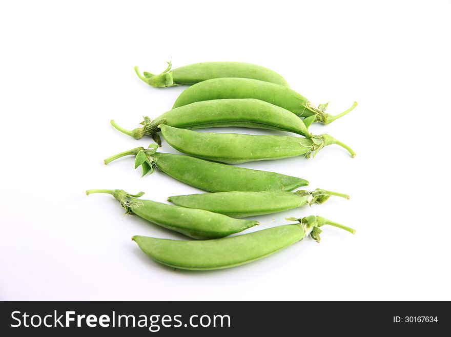 The Green peas on a white background. The Green peas on a white background.