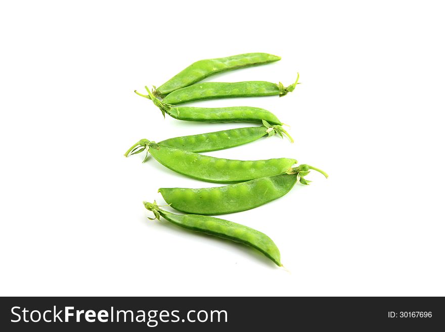 The Green peas on a white background. The Green peas on a white background.