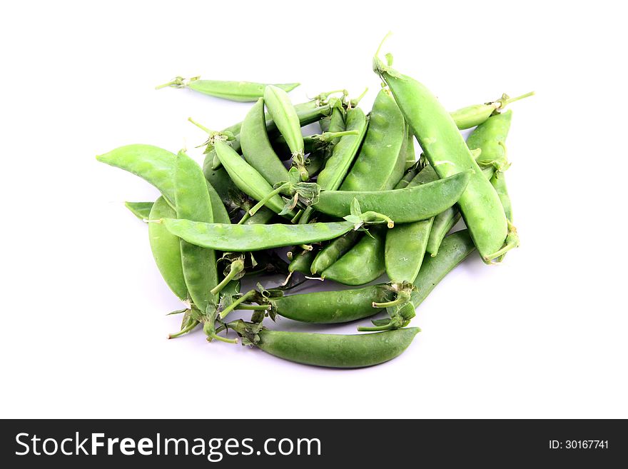 The Green peas on a white background. The Green peas on a white background.