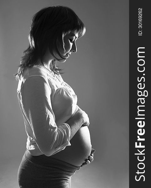 Young pregnant woman black and white