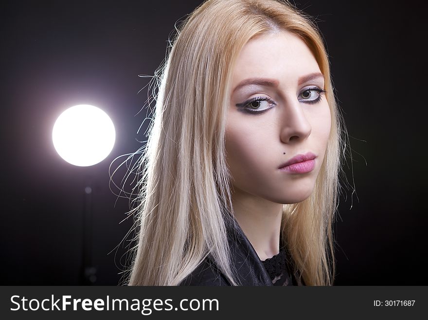 Portrait of a blonde with a light behind her
