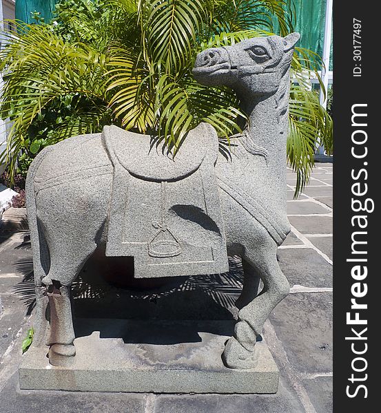 Stone horse statue isolated on a black background. Stone horse statue isolated on a black background