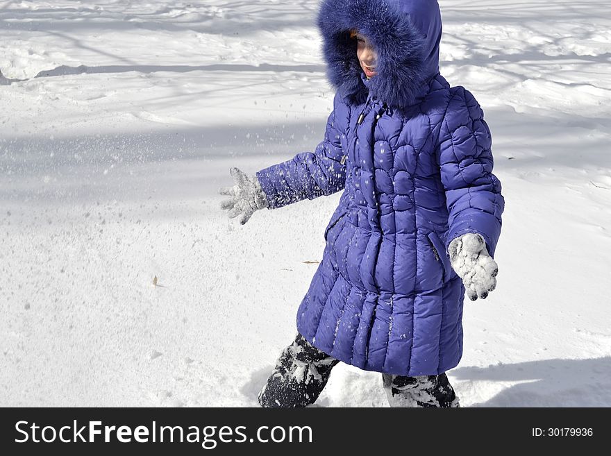 Child playing in the snow. Child playing in the snow