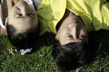 Seniors Couple Lying On Grass Stock Photos