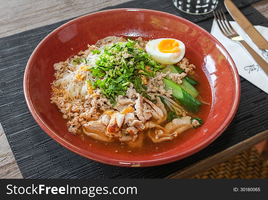 Thai noodle soup with pork and egg