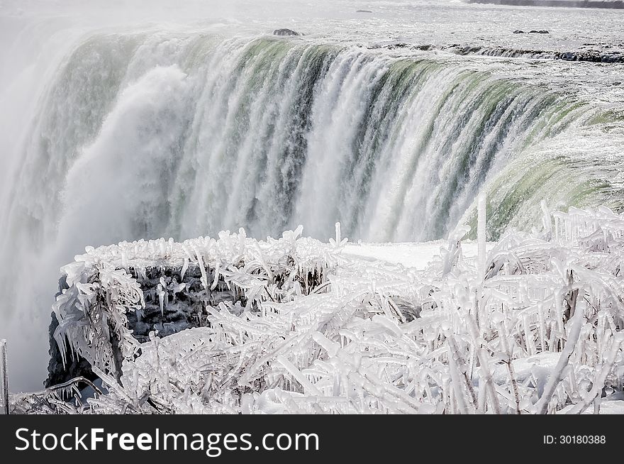 Niagara falls on a snowy landscape on winter time