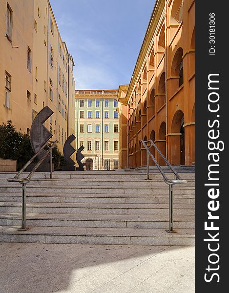 Image taken in Place du Palais, Nice, France, 2013. This late afternoon photograph includes classic architectural forms such as arches, sculptures, shadows and steps. Image taken in Place du Palais, Nice, France, 2013. This late afternoon photograph includes classic architectural forms such as arches, sculptures, shadows and steps.