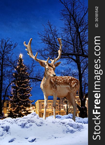 Christmas deer small town Xmas tree background. Christmas deer small town Xmas tree background