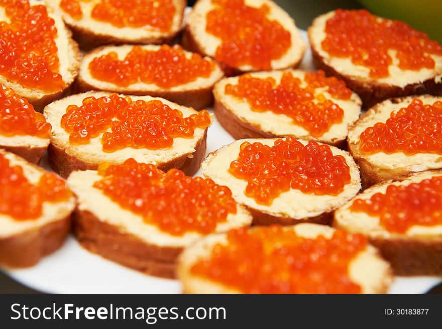 Sandwich with caviar at holiday table