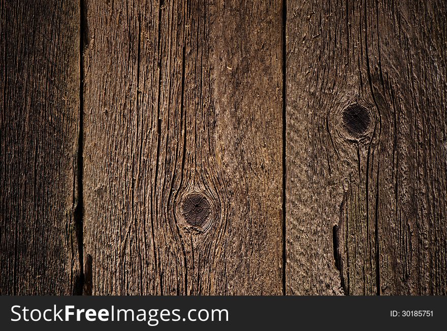 Background for design. The texture of old wood with cracks and knots