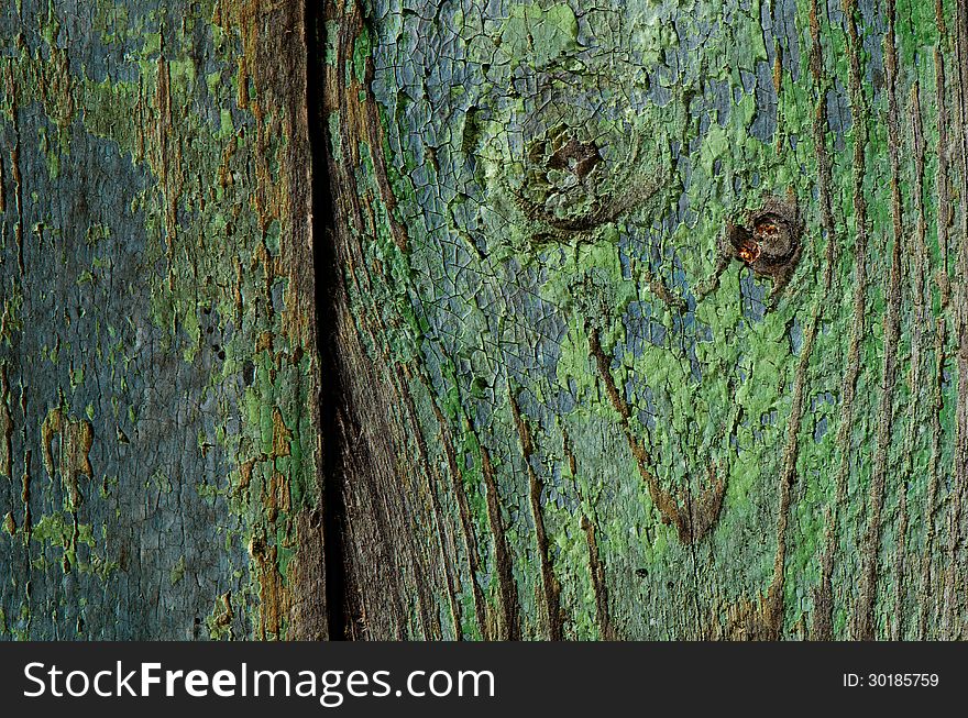 Texture of old paint on a wooden board. Texture of old paint on a wooden board