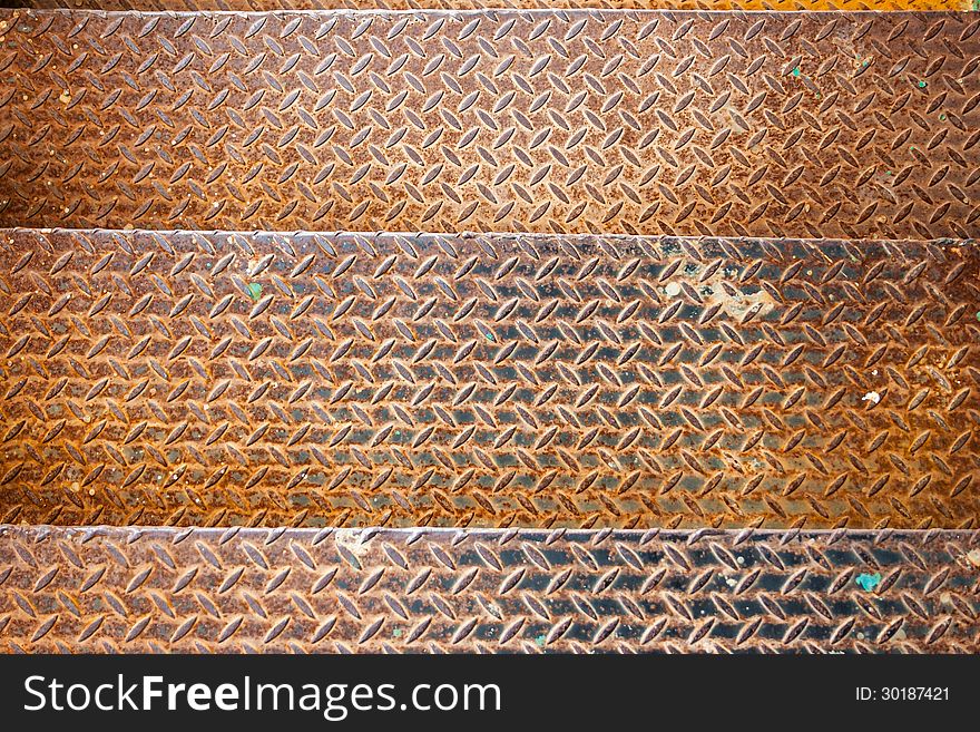 Three metal textured rusty yellow old stage. Three metal textured rusty yellow old stage