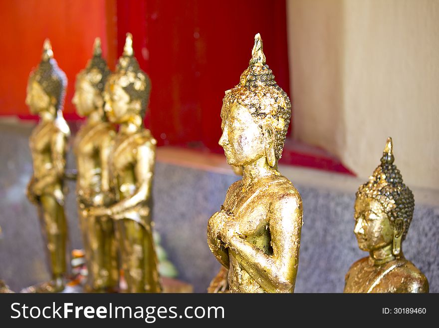 The Buddha statue covered with gold leaf