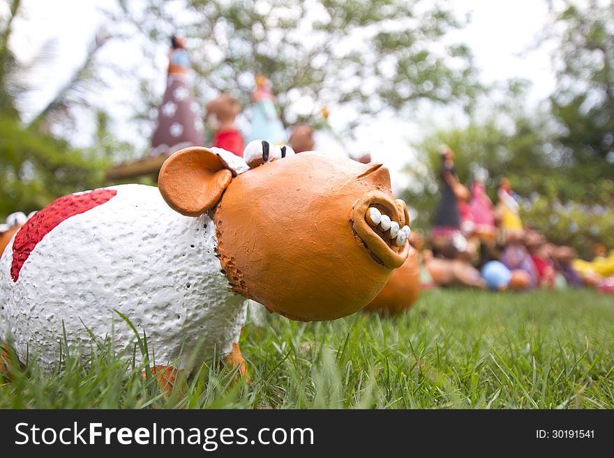 Smiling sheep pottery craft in the grass