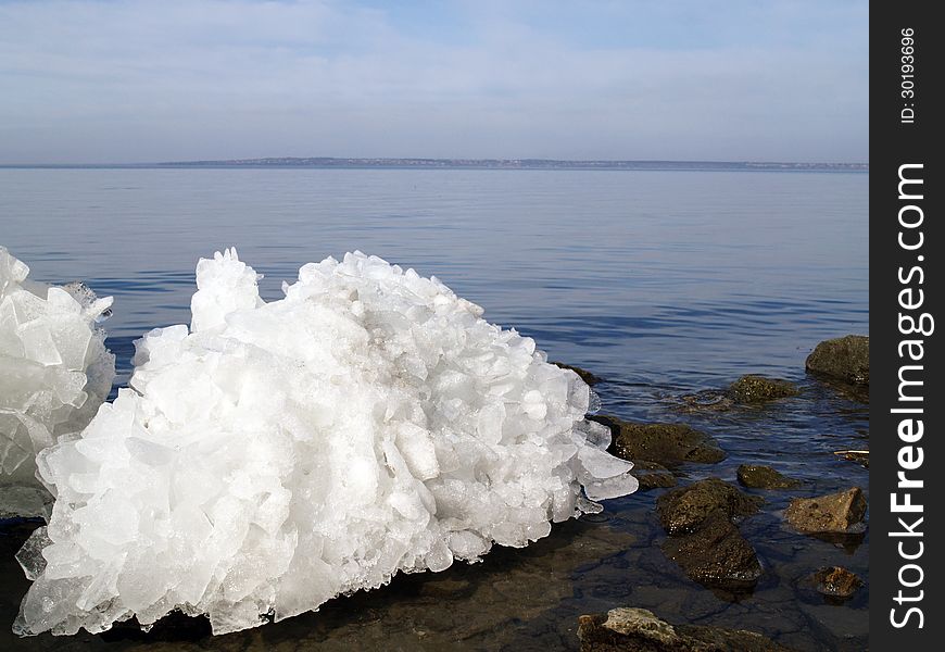 Broken ice on water background