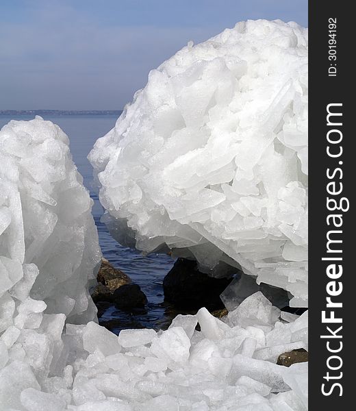 Broken ice on water background