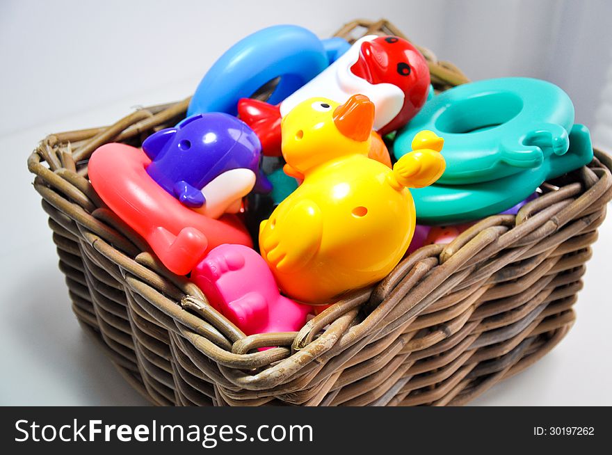 Knitting basket filled with toys. Knitting basket filled with toys