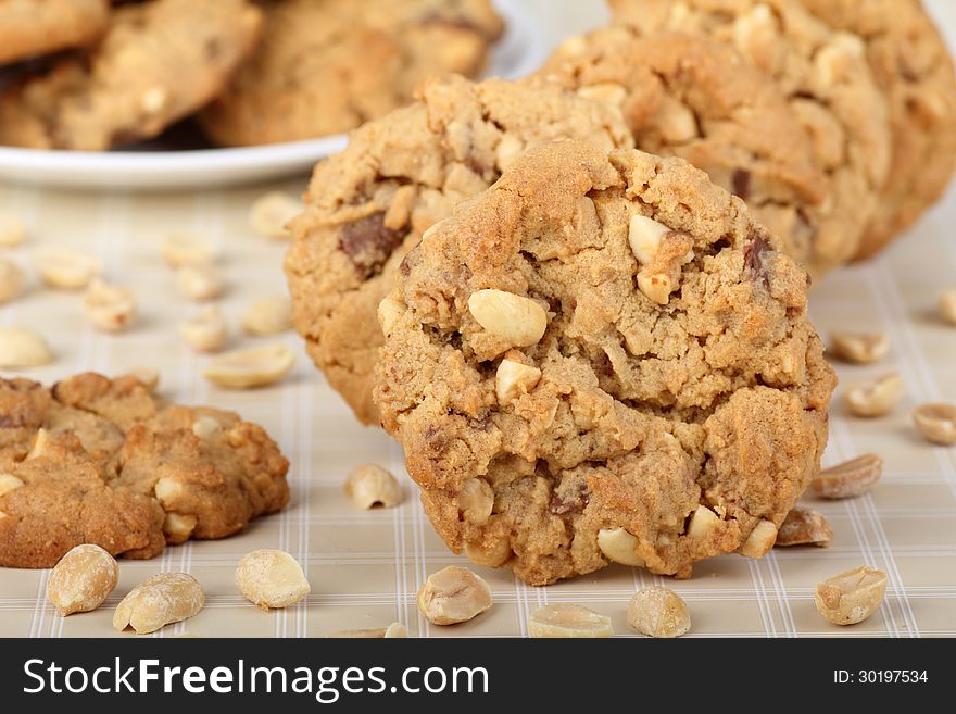 Peanut butter and nut cookies with peanuts on table. Peanut butter and nut cookies with peanuts on table